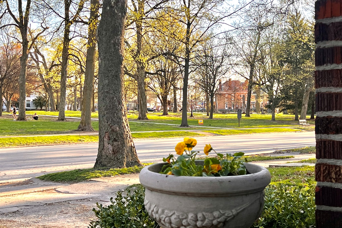 Front porch with seating located across from Franklin Park. A beautiful historic park with plenty of space to walk, relax or play.