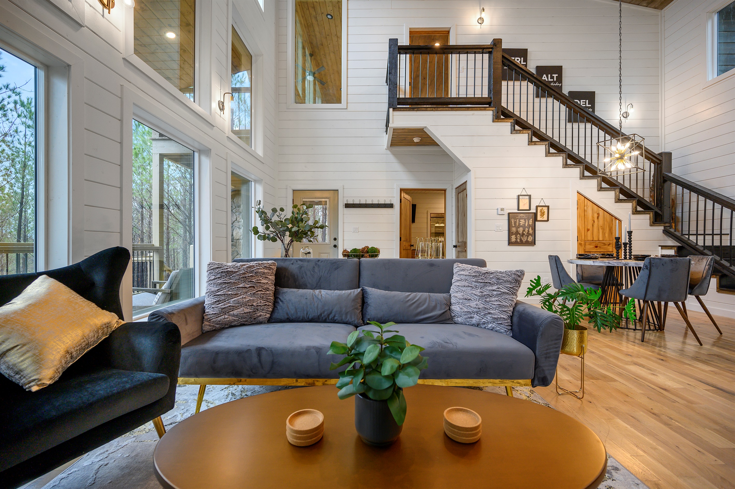 Open and cozy gathering space designed for comfort, with a fireplace and entertainment setup.