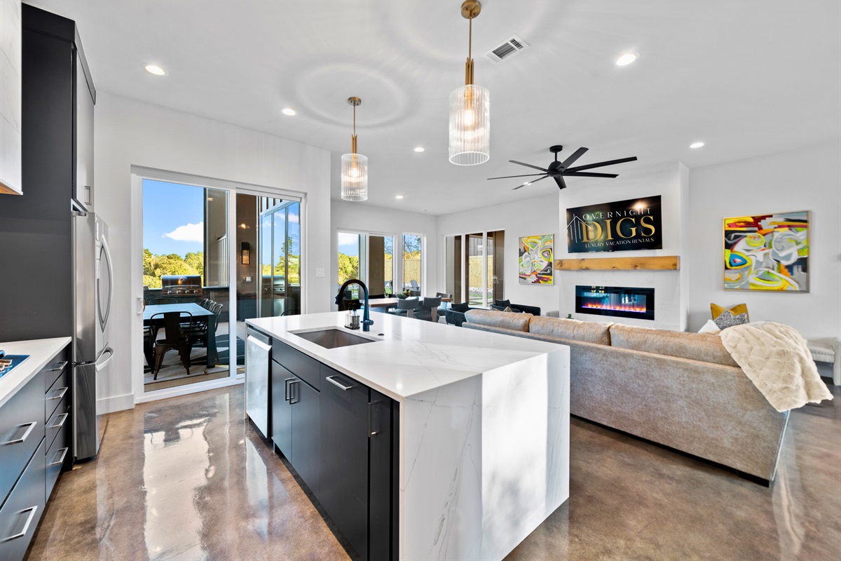 This bright and airy dining space invites everyone to gather for meals, games, and memories, all with beautiful views around.