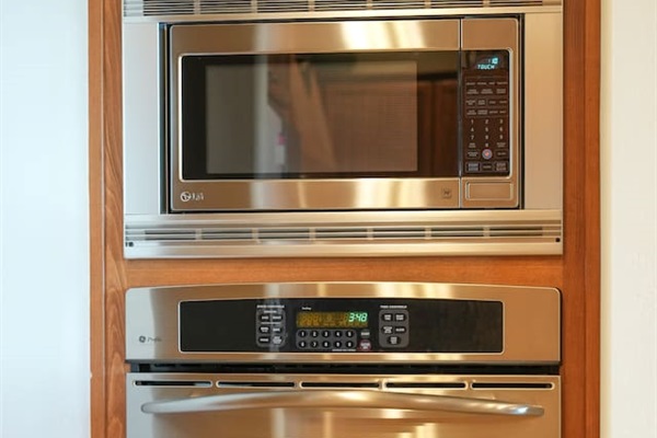Built-in stainless steel oven and microwave for convenient meal prep.