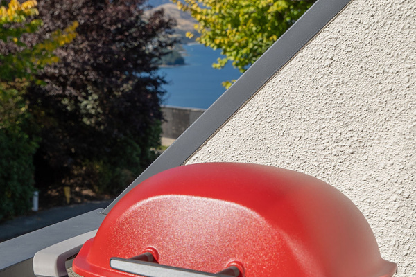 Weber BBQ on downstairs balcony. Views of the Remarkables in the background.