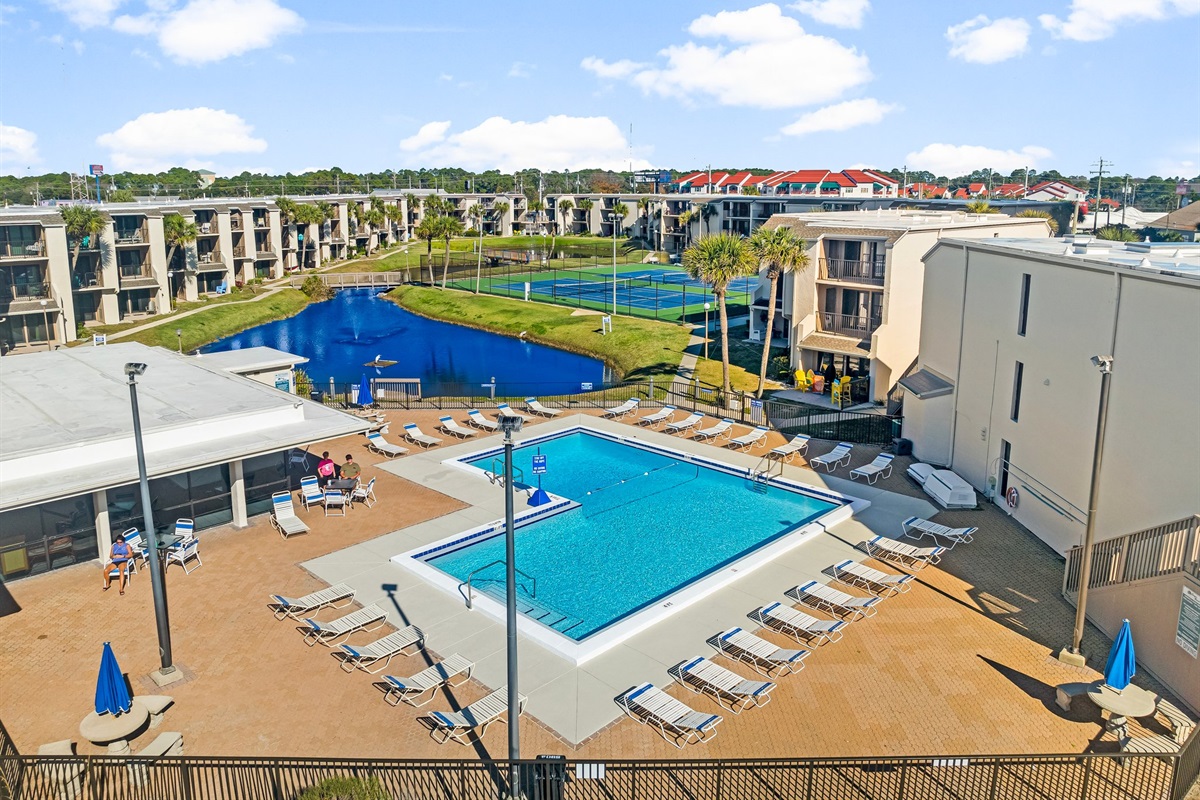 private pool and pickleball courts surrounded by relaxing pond