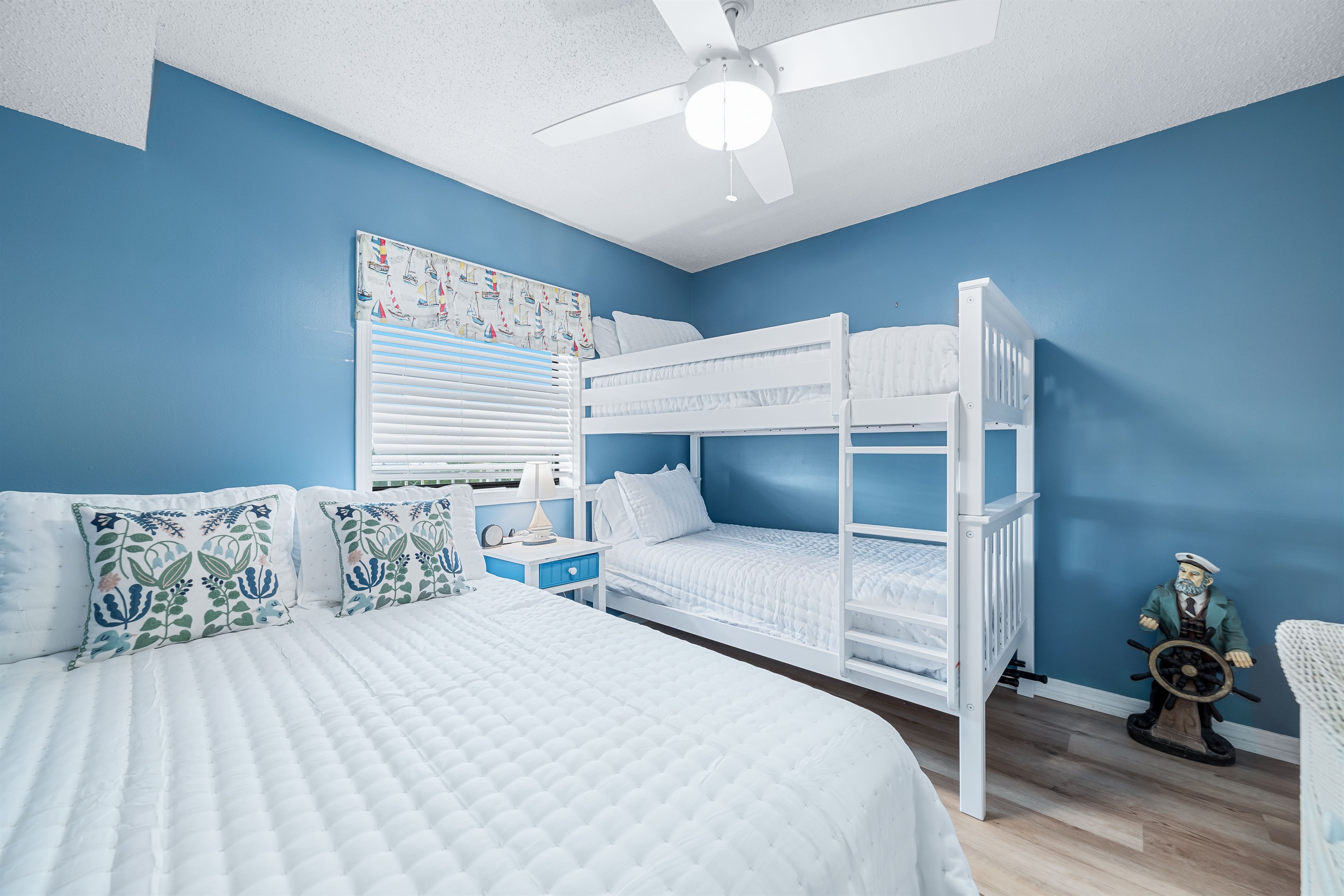 Perfect for families or groups, this guest room with queen bed and bunk bed provides a fun and functional space. The thoughtful design ensures comfort and convenience for all.