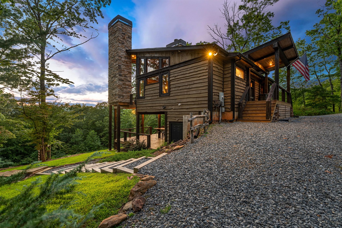 Steps down to the lower deck and firepit area