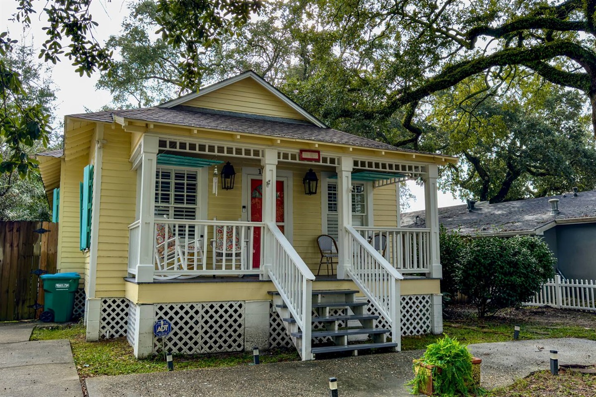 Charming standalone cottage with a front porch, private driveway, and a warm, inviting coastal vibe.