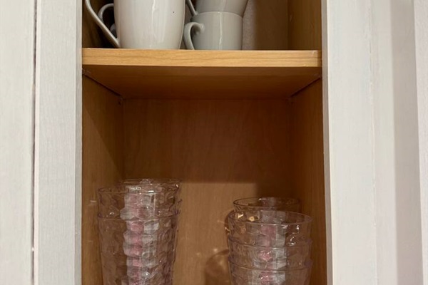 Mugs and tall plastic glasses