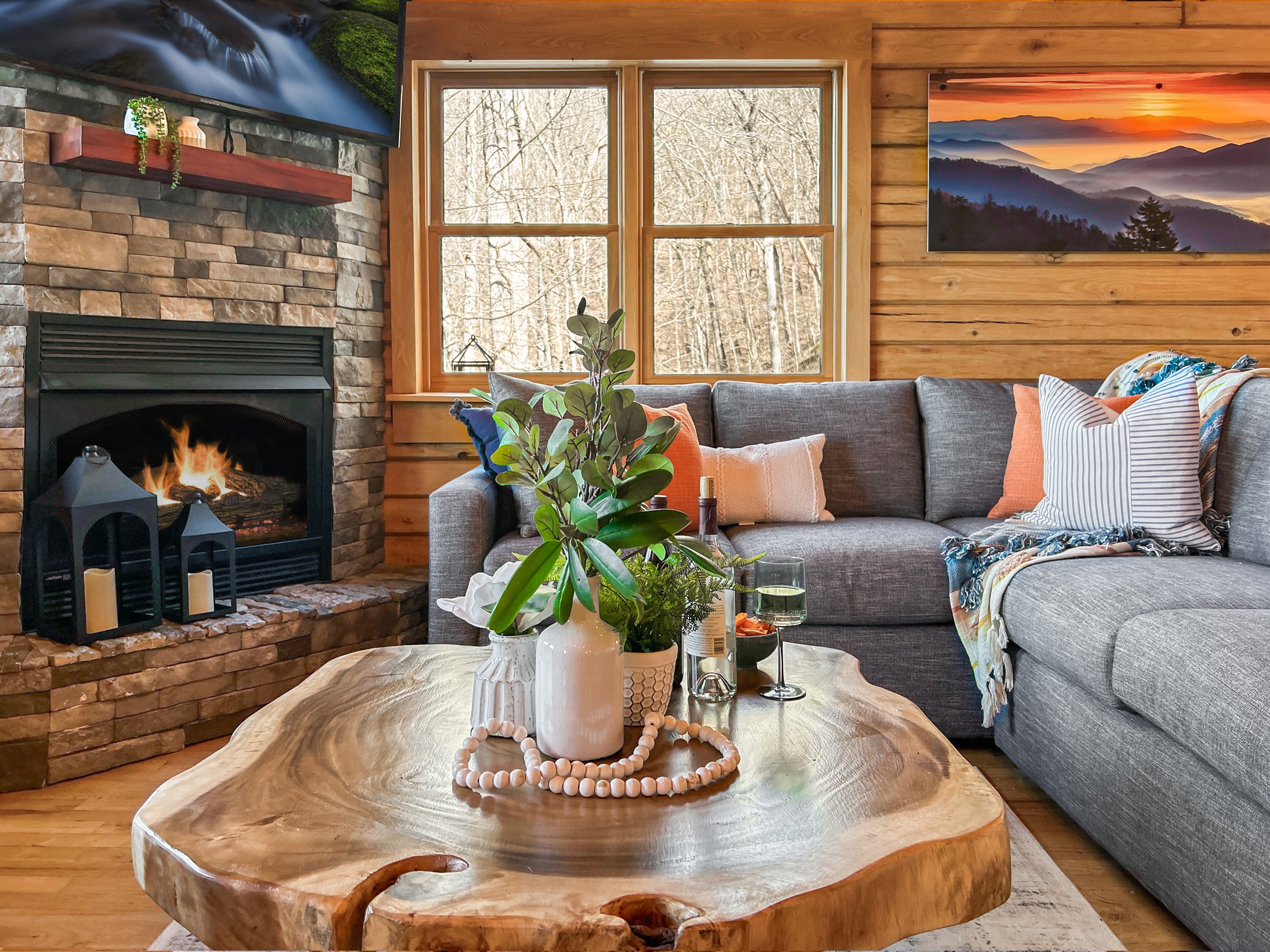 The main living space features a giant sectional couch along with two large leather chairs.