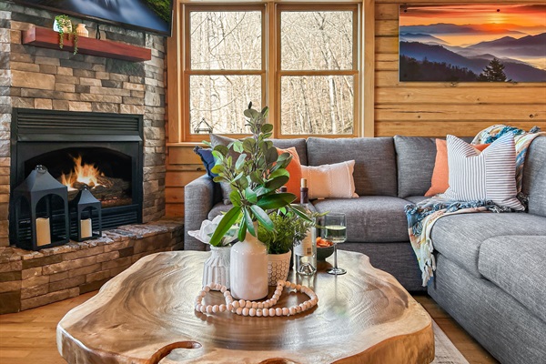 The main living space features a giant sectional couch along with two large leather chairs.