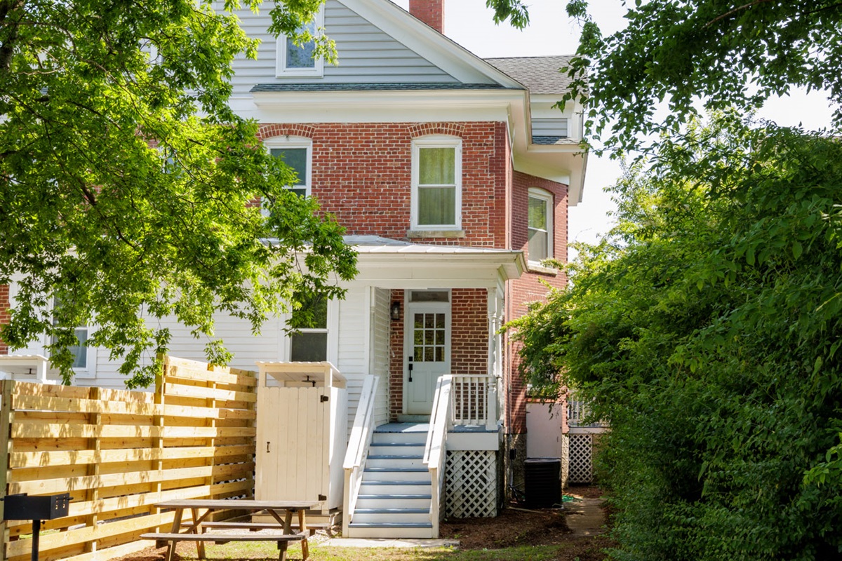 Shared backyard offers additional parking. A BBQ grill and outdoor seating have been recently installed behind the house on each side as well.