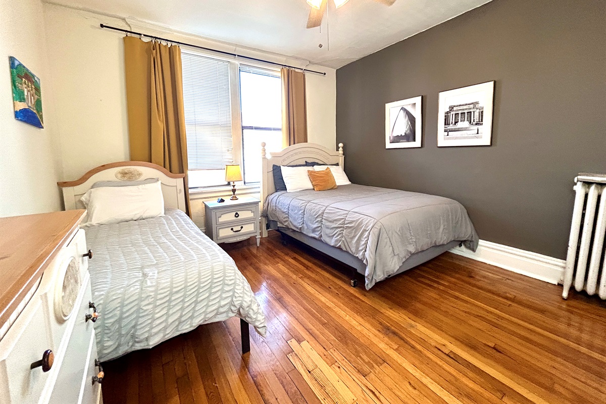 2nd bedroom with queen and twin beds. Closet and dresser for clothes.