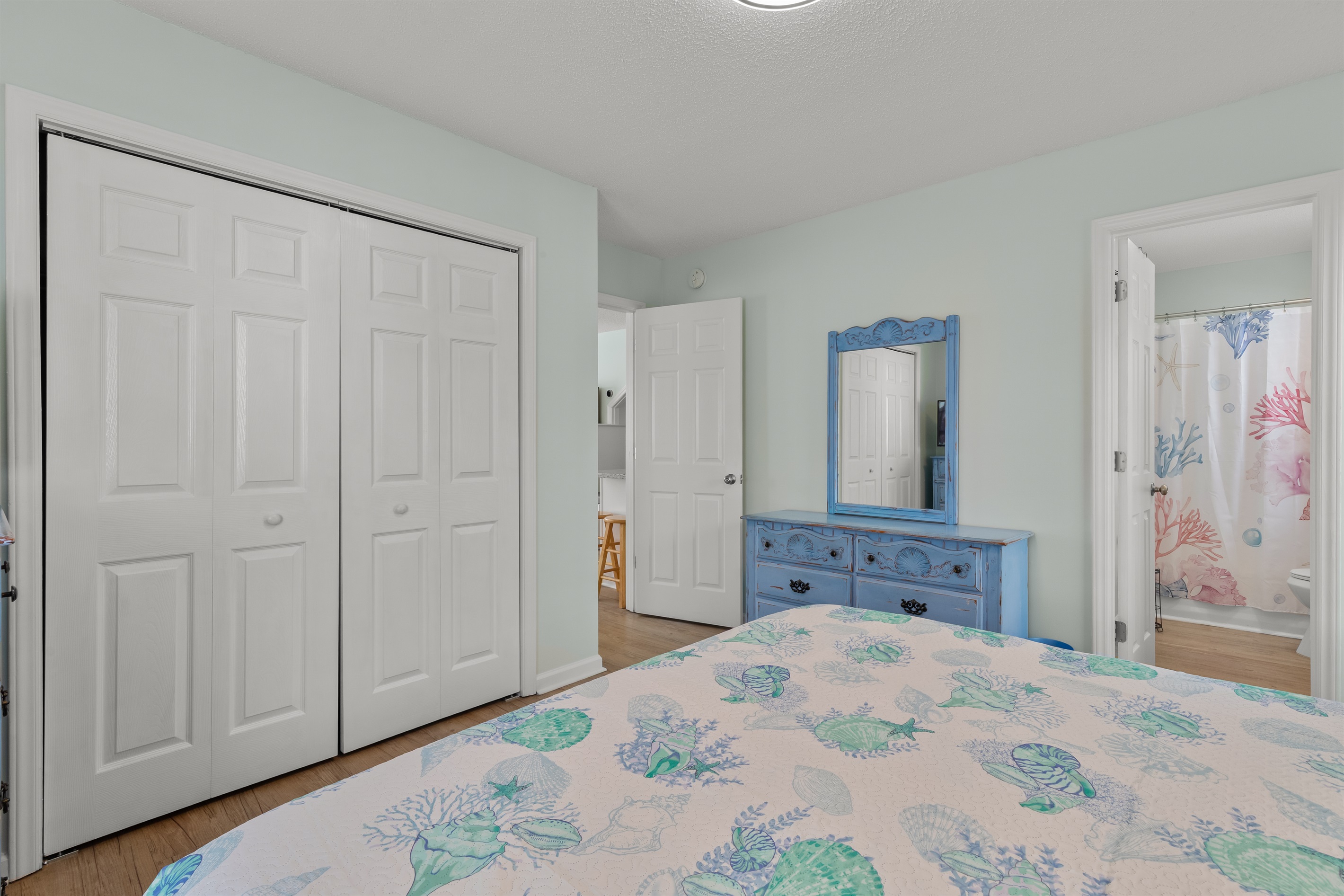 Primary Bedroom with King bed, ensuite bathroom and Smart TV