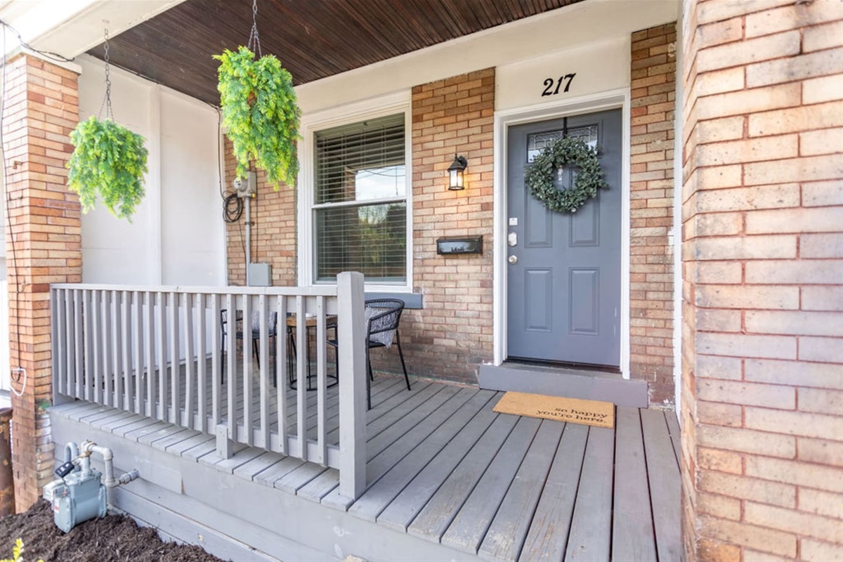 Inviting entrance patio leading to a charming front door, welcoming you to your home away from home.
