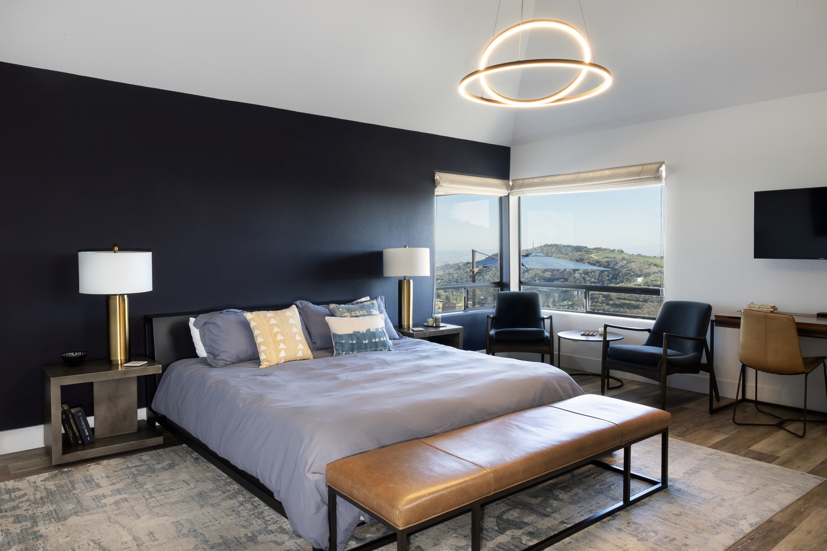 Floor-to-ceiling views of the Paso Robles hills frame this sophisticated master retreat. Wake up to panoramic wine country vistas without leaving your bed.