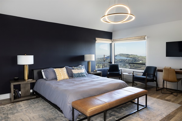 Floor-to-ceiling views of the Paso Robles hills frame this sophisticated master retreat. Wake up to panoramic wine country vistas without leaving your bed.