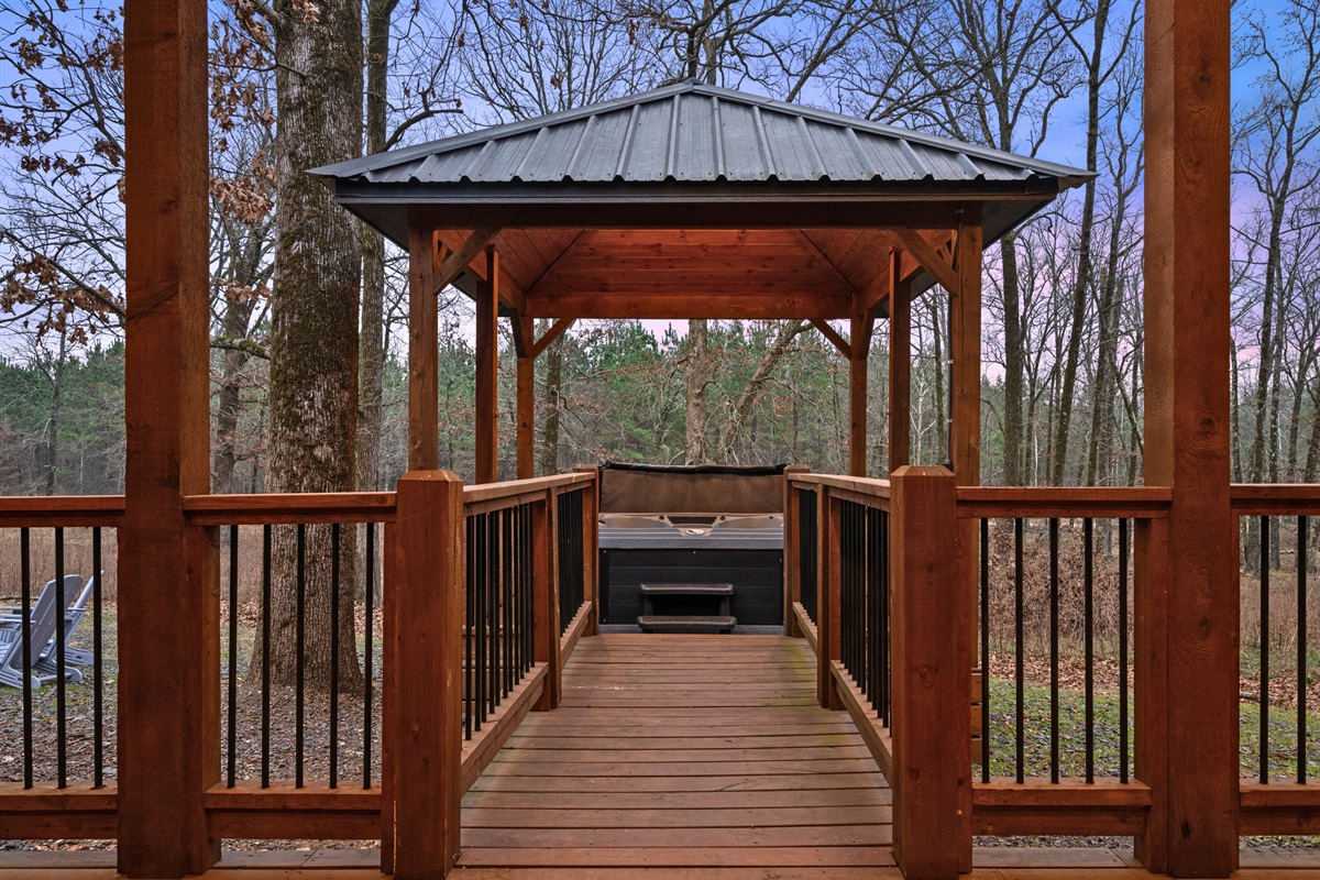 Wandering down this path toward the gazebo feels like a little escape, surrounded by tall trees and peaceful cabin scenery.