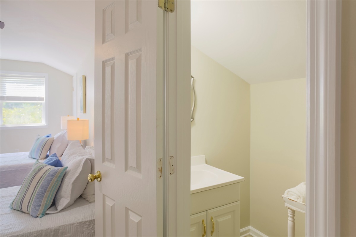 Convenient half bath adds comfort and privacy for loft guests.