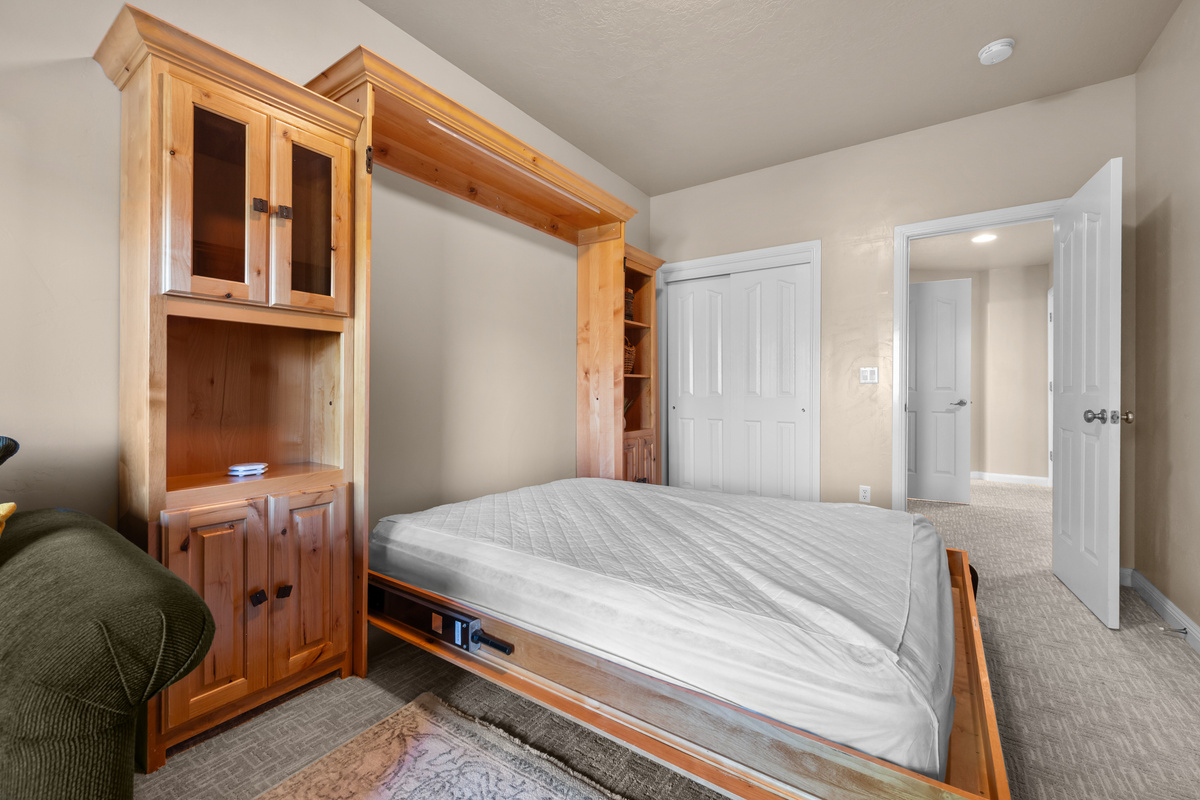 Comfortable Murphy bed provides extra sleeping accommodations without sacrificing space.