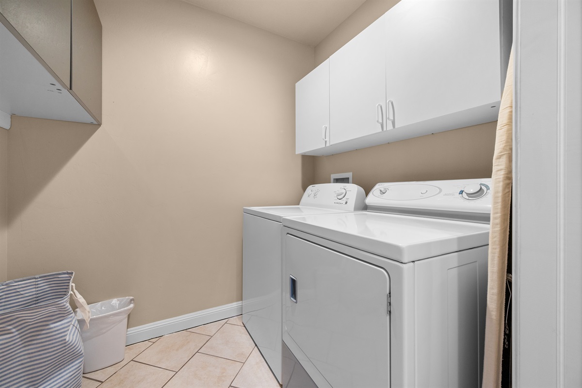 Convenient laundry room with washer and dryer for extended stays.