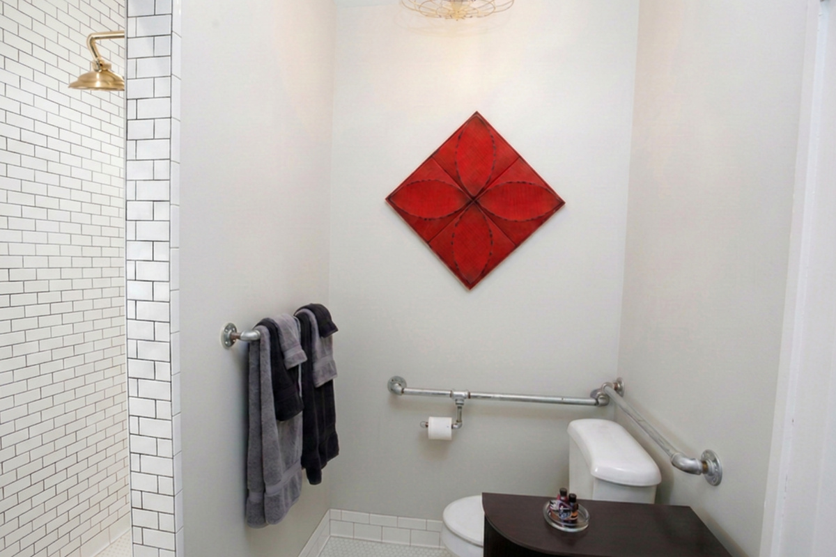 Handy-dandy grab rails around the commode for your convenience