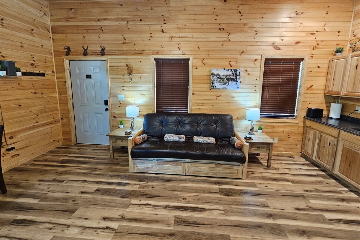 Stretch out on the rustic futon after a day of adventures — the perfect spot for reading, chatting, or an afternoon nap