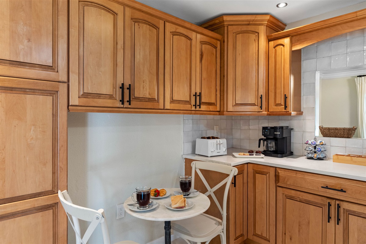 Rich wooden cabinetry provides a timeless look, perfectly complemented by updated hardware and finishes.