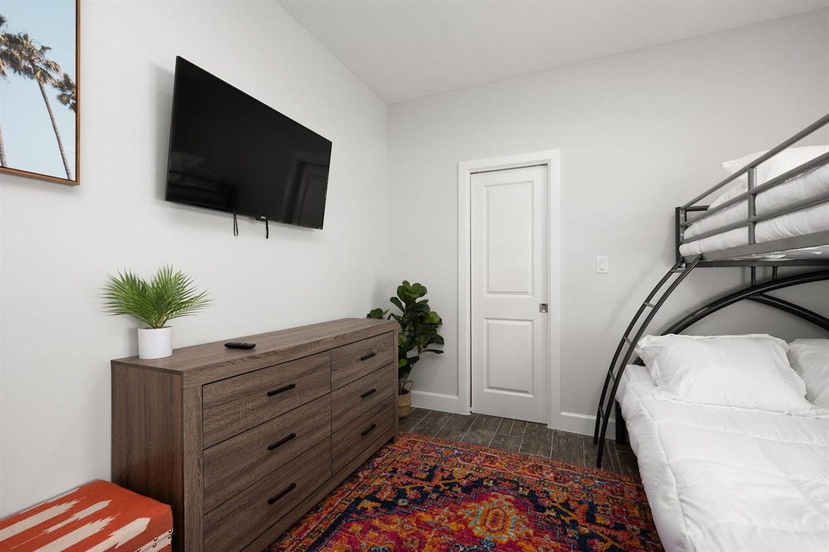 Bedroom with TV and cabinets