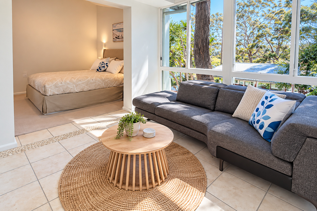 Enjoy the comfort of your own private retreat, featuring a peaceful bedroom and a bright adjoining sitting area. Large windows fill the space with natural light and offer a relaxing leafy outlook.