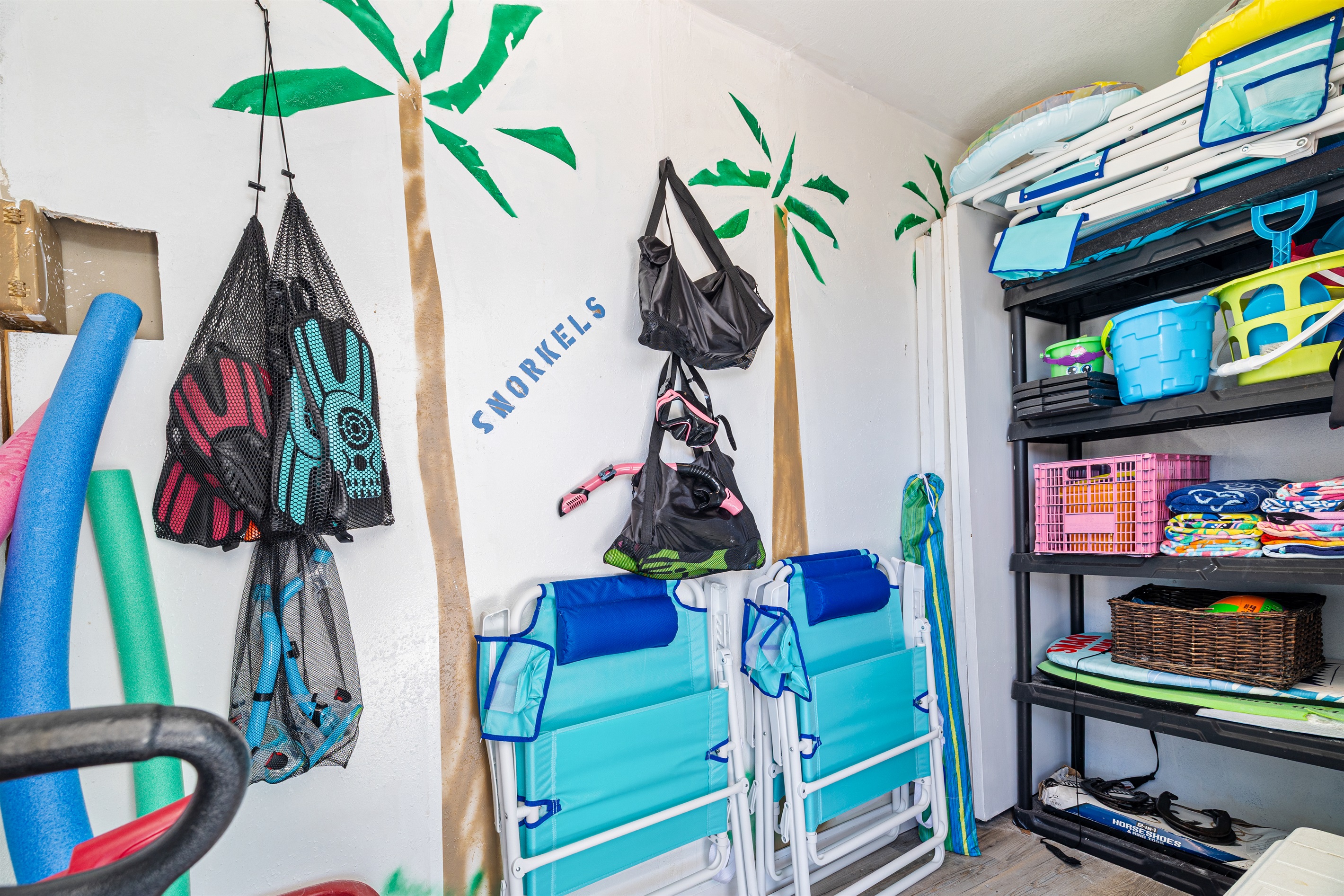Beach room full of Towels, 10 oversized Beachchairs, Snorkeling gear, Beach Toys, wagon, backyard games, umbrella, mat, and a Cooler!