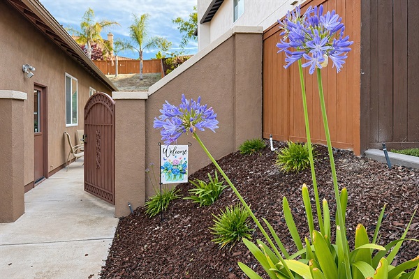 Private entry with walkway and patio seating outside the guest suite