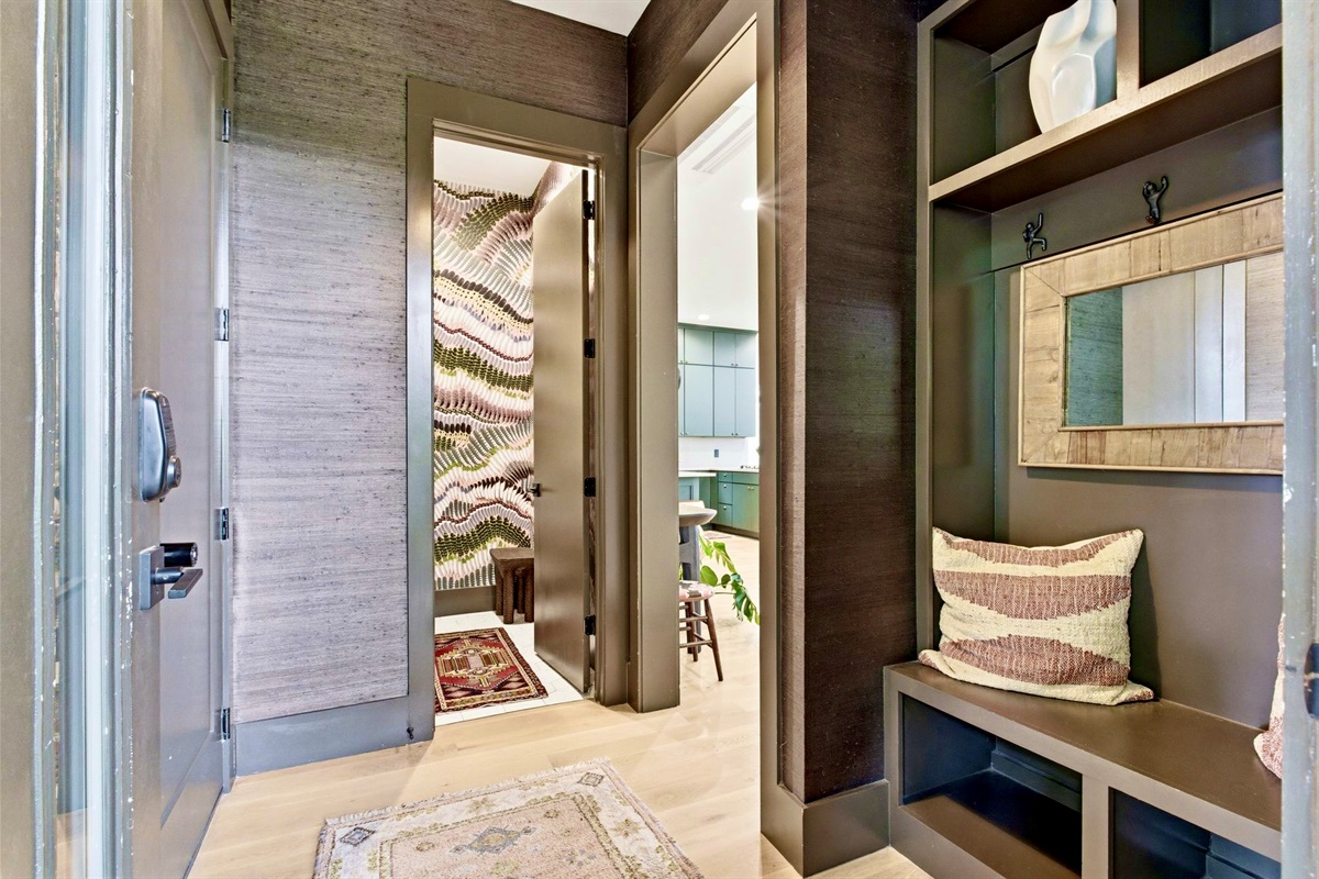 Intimate nook w/ built-in bench seating, wood paneling & a calm, tucked-away feel.