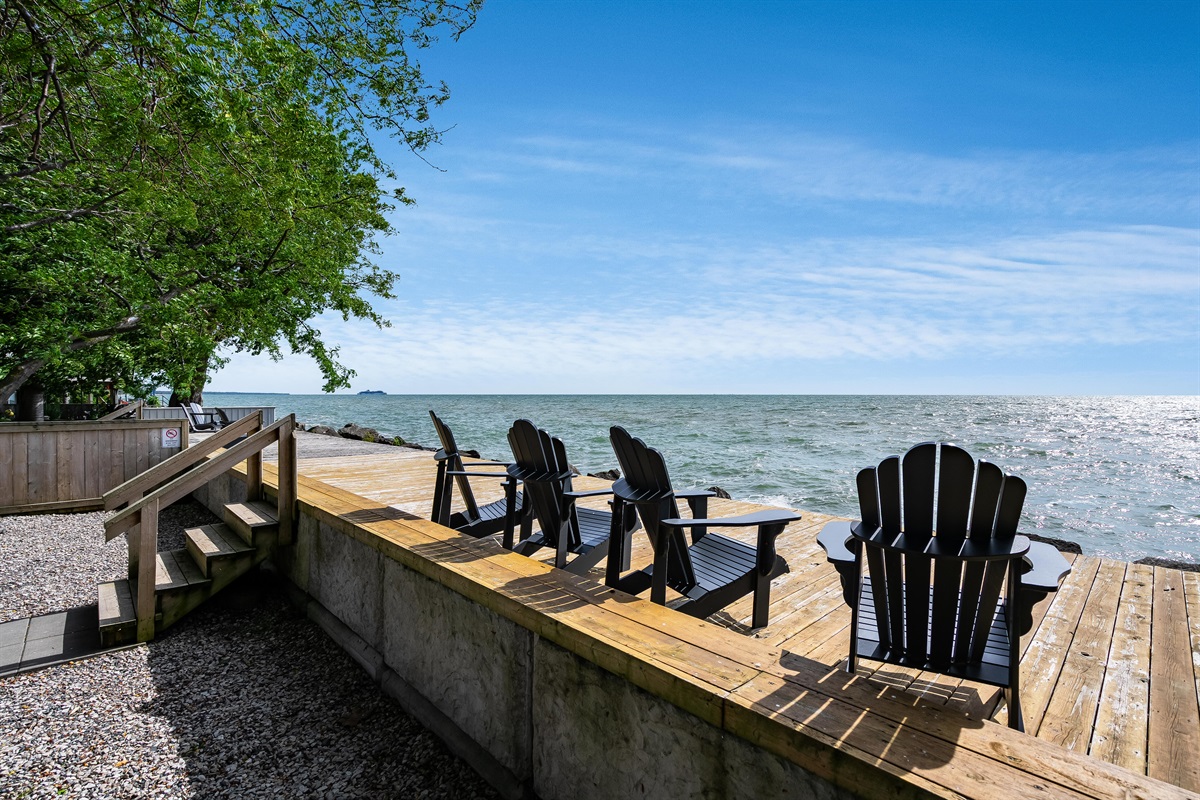 Water's edge deck with muskoka chairs