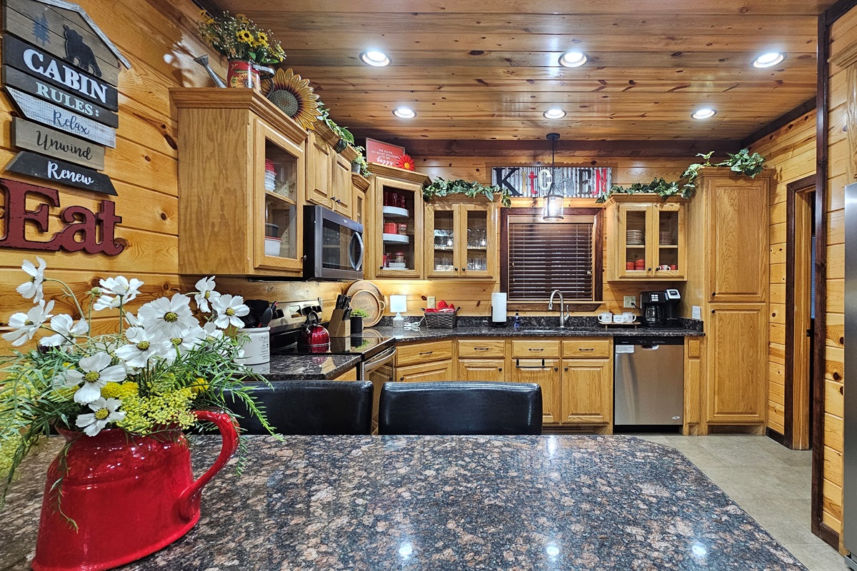 From stovetop to table, this kitchen setup makes it easy to prepare and serve meals without missing a beat. Cook up a hearty breakfast, gourmet dinner, or late-night snack and enjoy it together at this custom table made for eight!