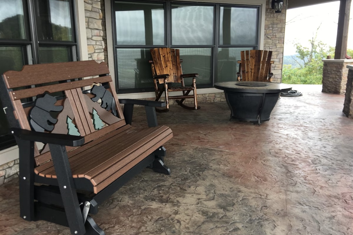 Plenty more seating with rockers and a fire pit on the patio.