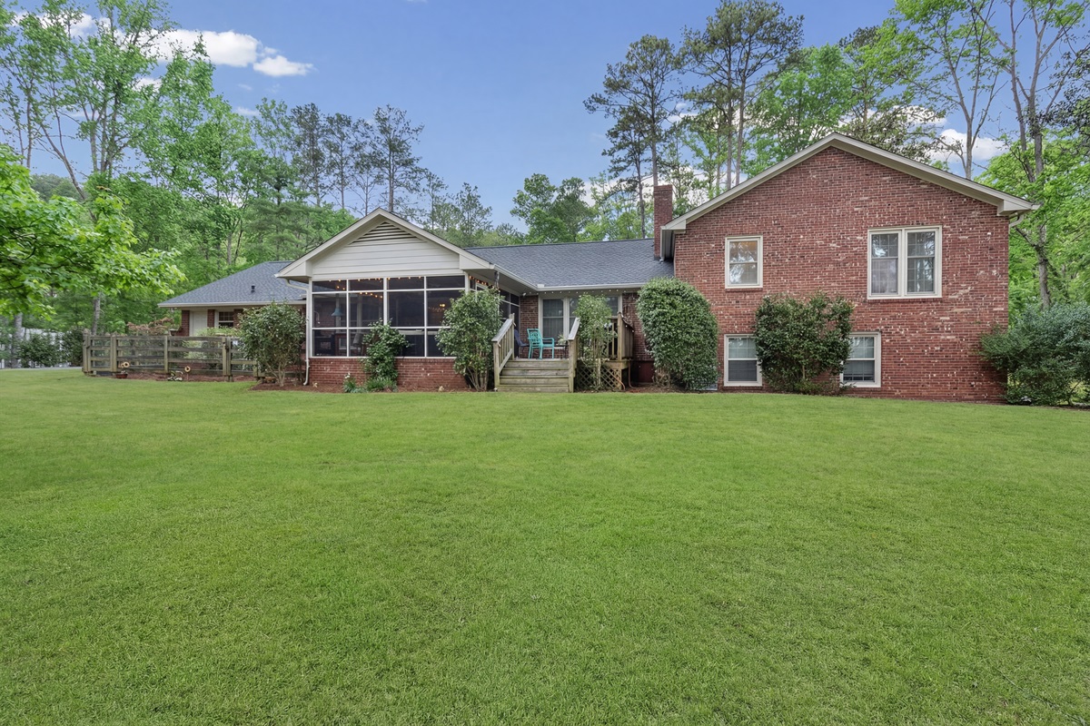 Large backyard with a screened porch for relaxing outdoors