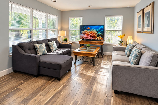 Living Room: Bright and airy space with stylish seating, perfect for relaxing after beach adventures!