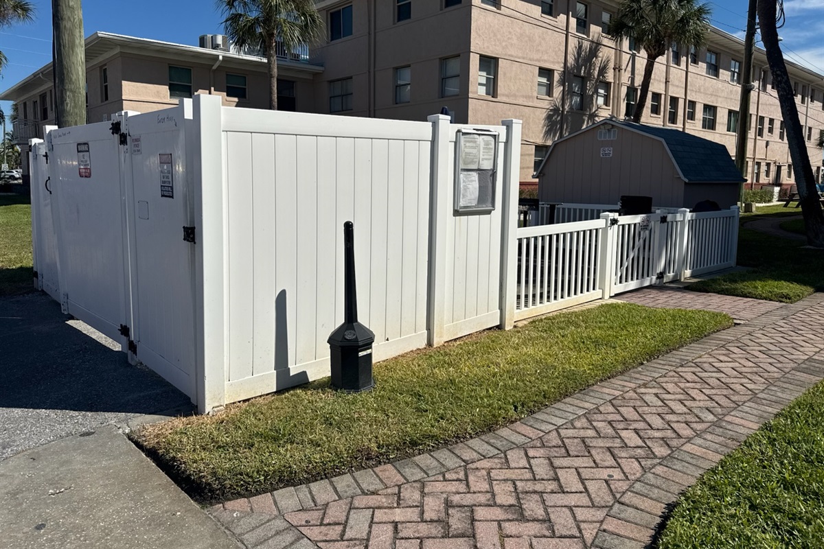 Dumpster area in in the alleyway behind unit's building
