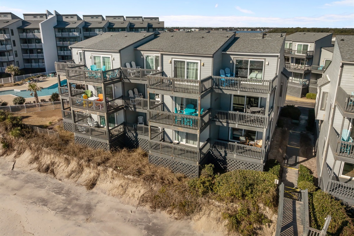A great setup for family vacations, with the beach out front and the community pool nearby