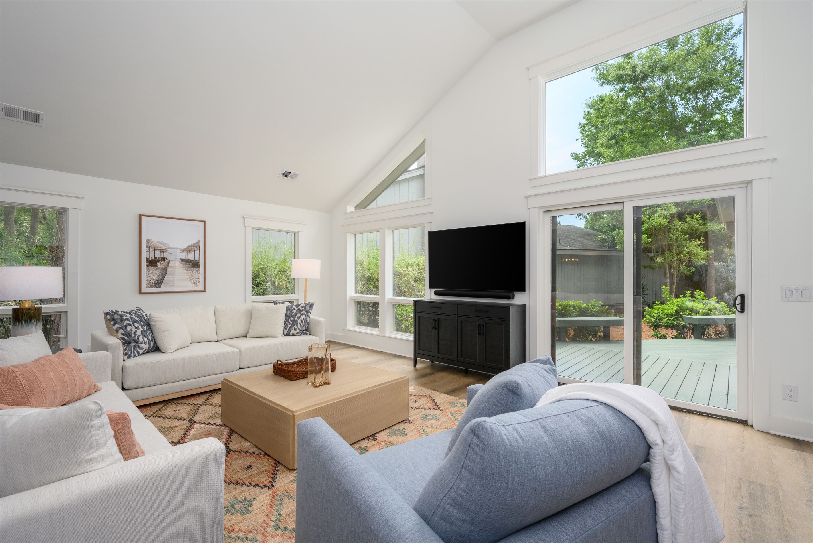 Family room features a beautiful 65" Samsung QLED TV