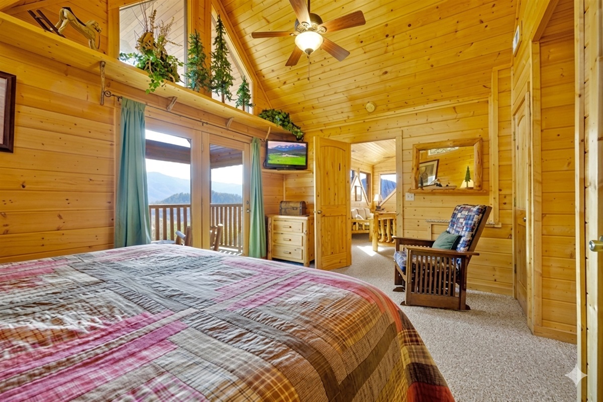 Bedroom #2 - This bright, airy suite opens up to stunning views and golden morning light. Unwind in bed, watch the sunrise, or step onto the balcony for a breath of fresh mountain air.