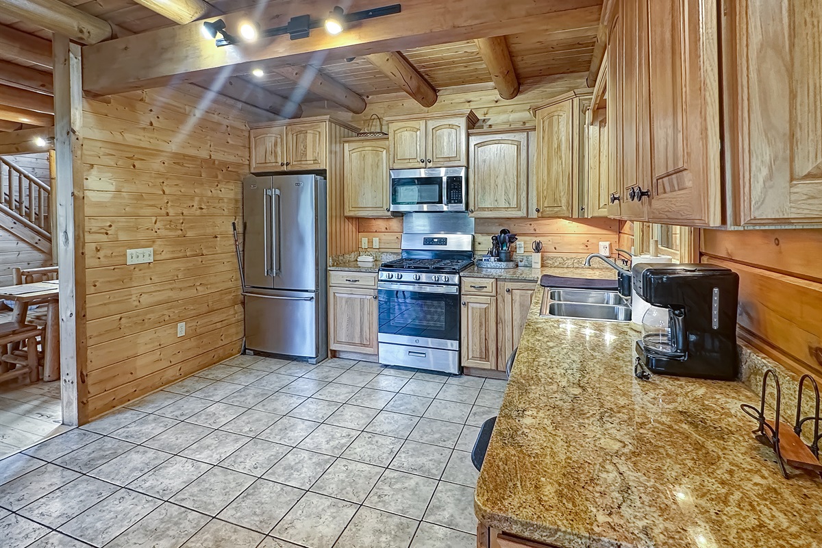 Kitchen: Whip up delicious meals in this spacious gourmet kitchen with modern appliances!