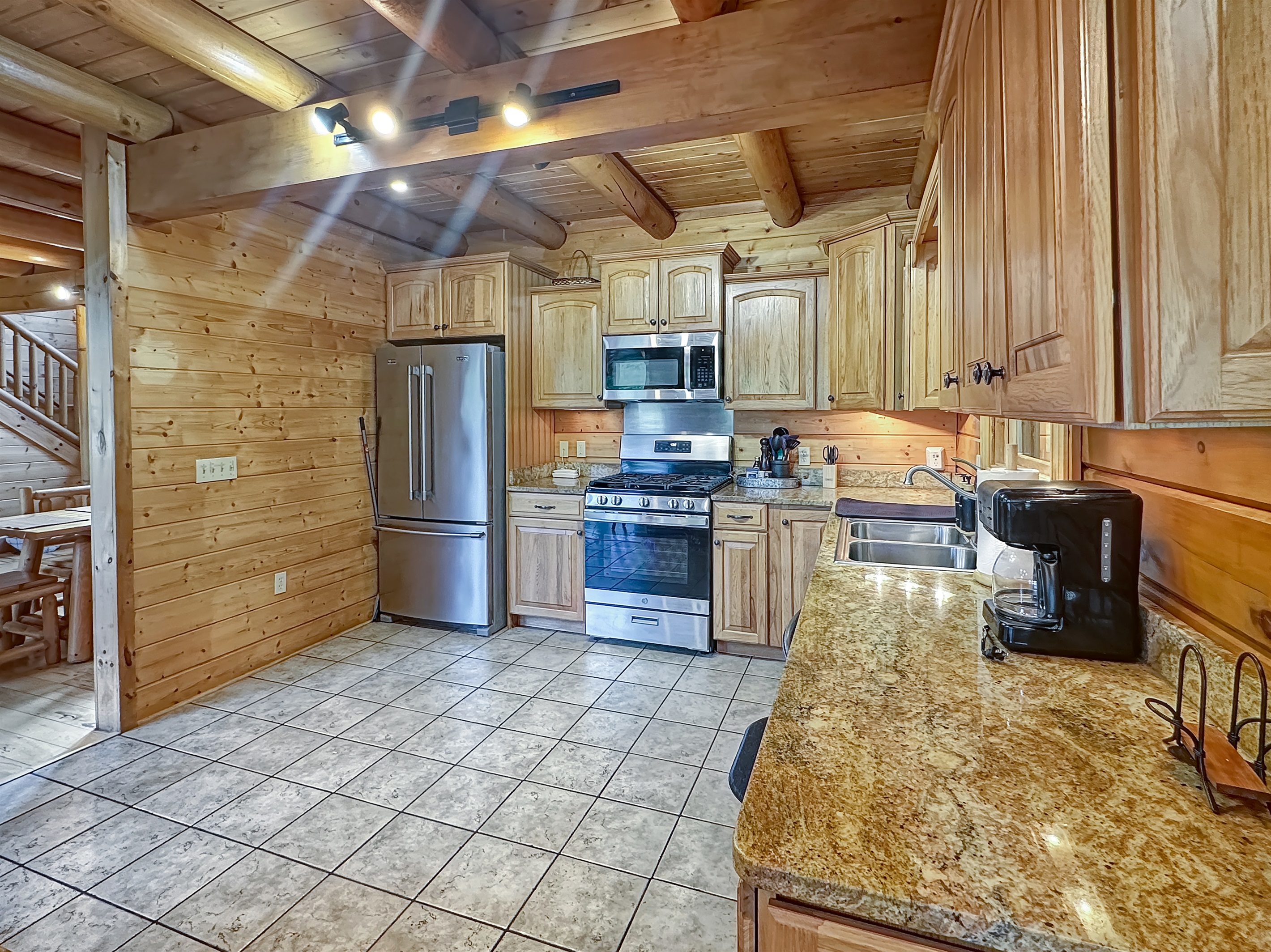 Kitchen: Whip up delicious meals in this spacious gourmet kitchen with modern appliances!