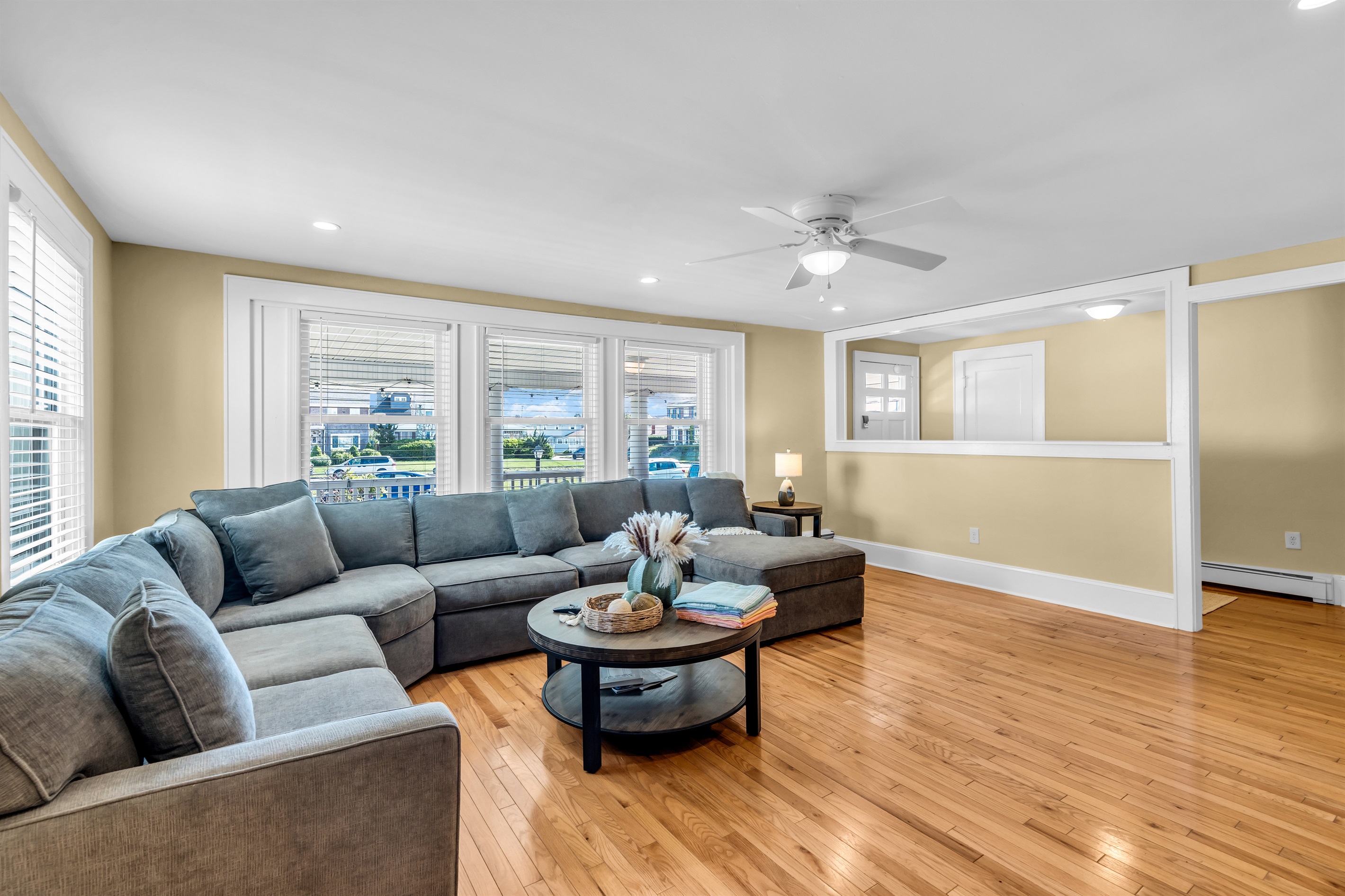 Huge wide open living room with natural light, high end sectional for you to enjoy with the family.