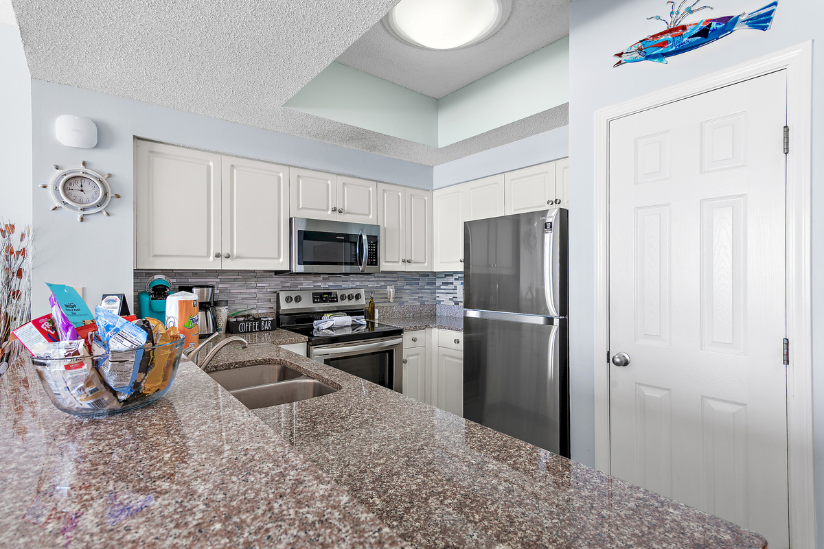 Kitchen has GULF VIEWS, granite countertops, stainless appliances - fully stocked with more than the basics (coffee/tea bar, oils/salt and pepper, plenty of pots/pans/cookware)