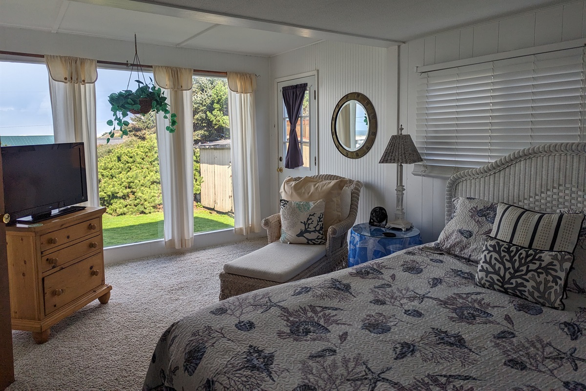 queen bedroom with TV