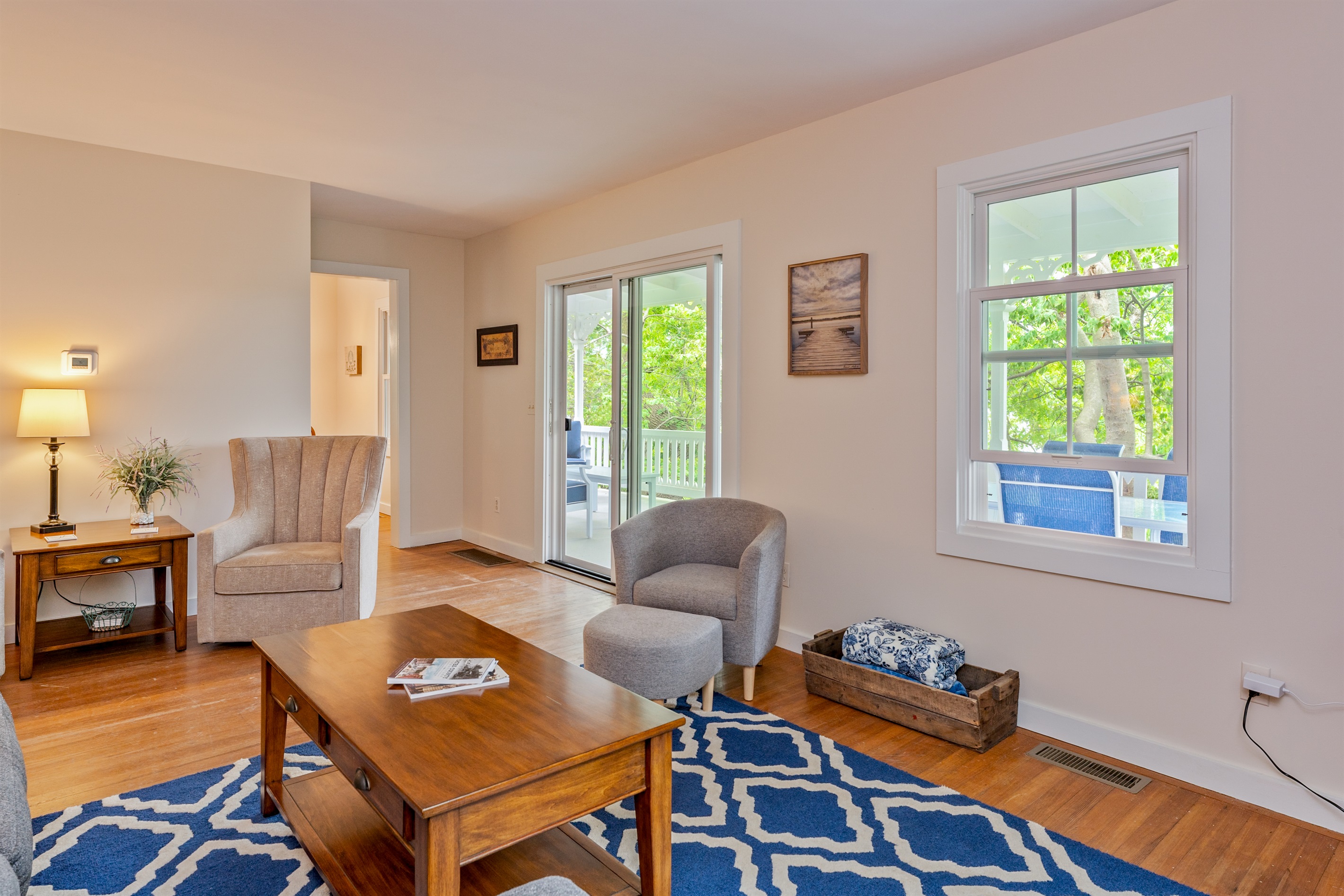 Gather with friends and family in a cozy living space featuring a large sectional, soft lighting, and a welcoming open layout.