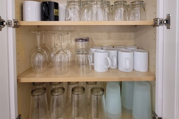 Set of glasses, mugs, and plastic cups.