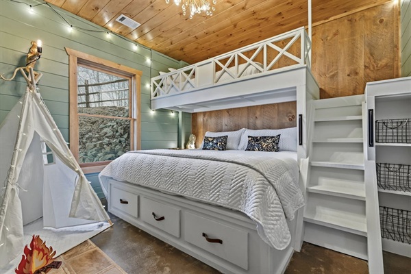 Kids (and adults!) will love this magical fantasy bedroom featuring a comfy king below and twin XL loft above. Complete with a cozy play tent, twinkling string lights, fun chandelier, built-in charging outlets in the nook, and plenty of storage.
