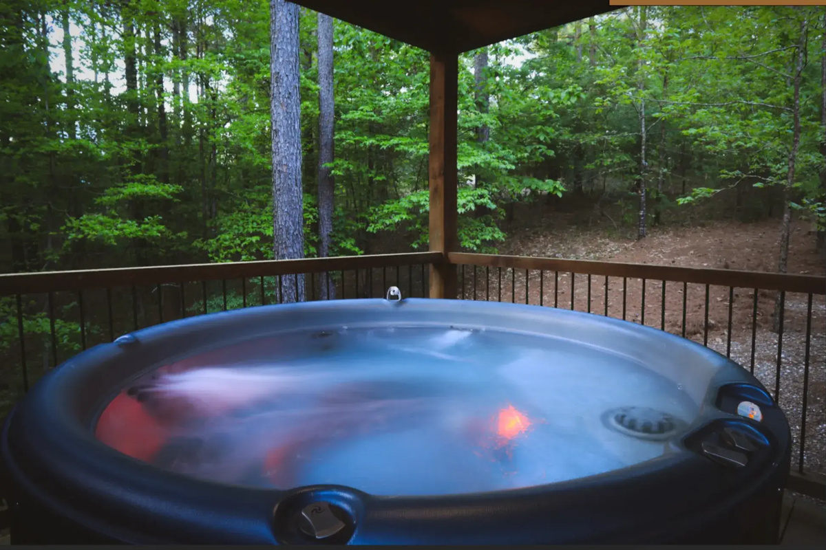 Hot Tub Retreat: Soak under the stars surrounded by serene forest vibes and soothing sounds!