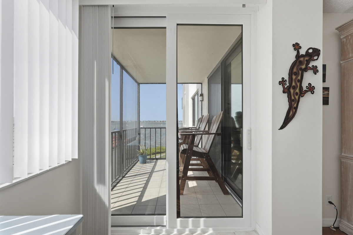 Step onto the screened-in balcony and take in peaceful waterfront views—an ideal spot for morning coffee, an evening unwind, or simply enjoying the gentle Florida breeze.