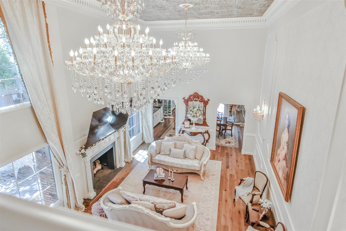 From every angle, elegance reigns—velvet sofas, gilded frames, and chandeliers that steal the spotlight.